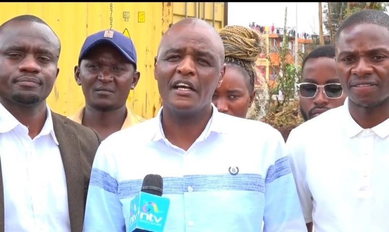 Kenya Teachers in Hardship and Arid Areas Welfare Association (KETHAWA), Ndungu Wangenye addressing the press as other teachers looks on.