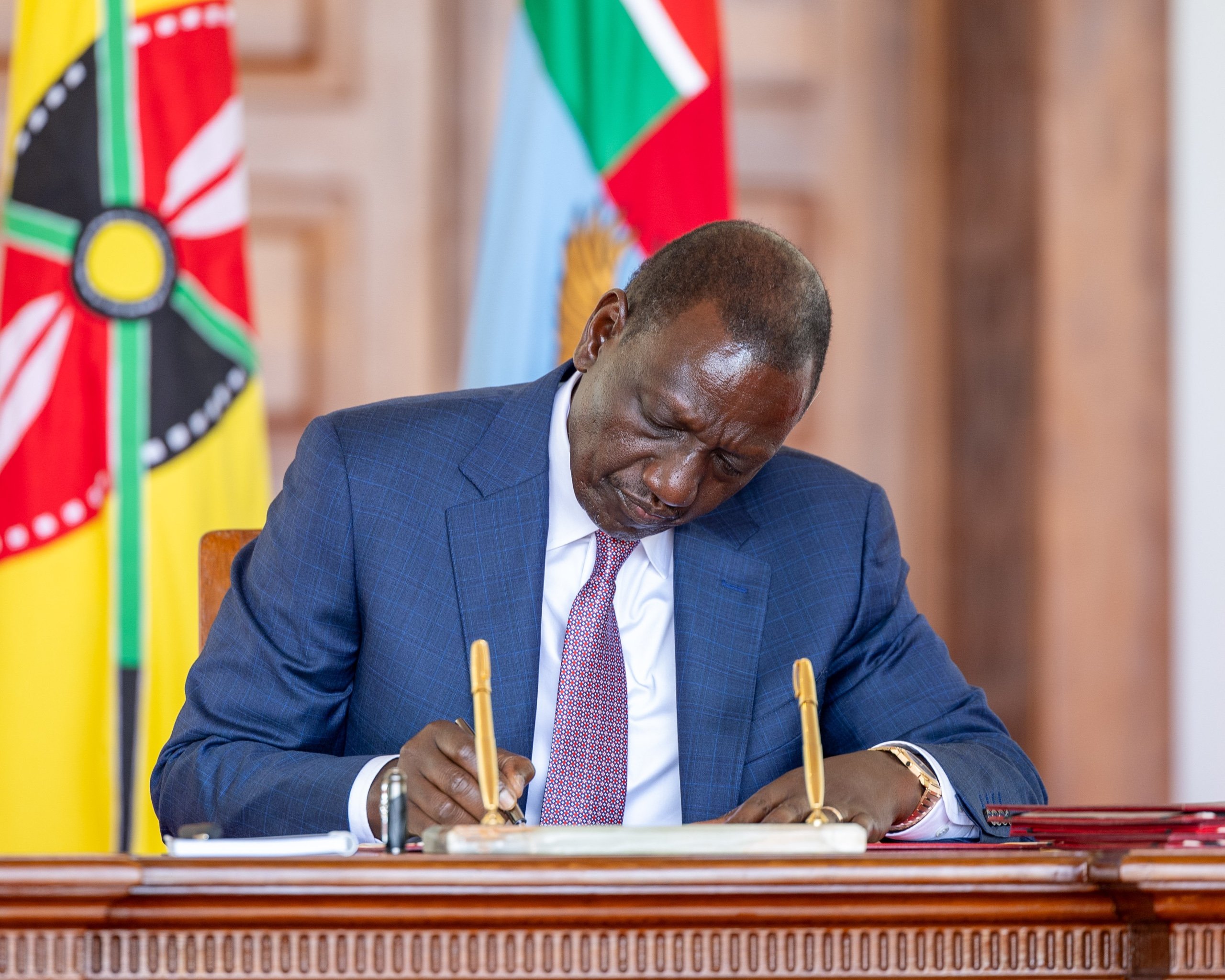 President William Ruto signing Bill into law