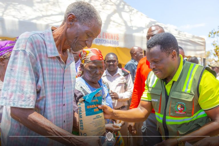 Tharaka-Nithi Governor Muthomi Njuki (right) issuing free certified seeds at a past event.