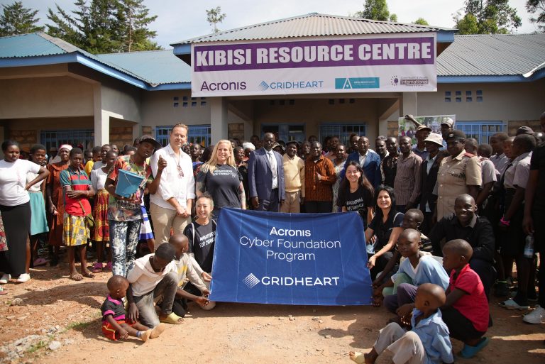 A photo of the Acronis cyber Foundation team with Kibisi locals and students during the the official launch of the resource cente