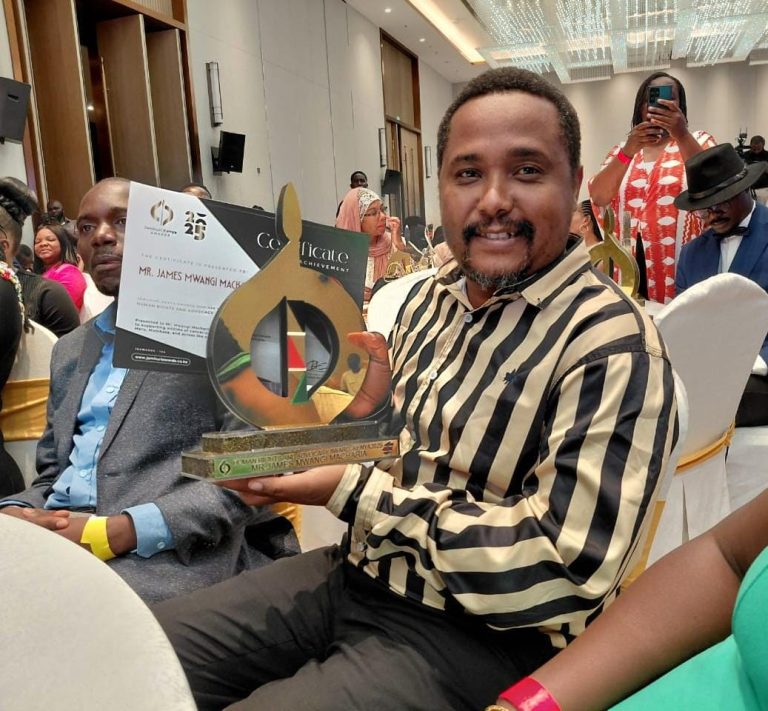 ACCPA founder James Mwangi Macharia displaying his trophy.
