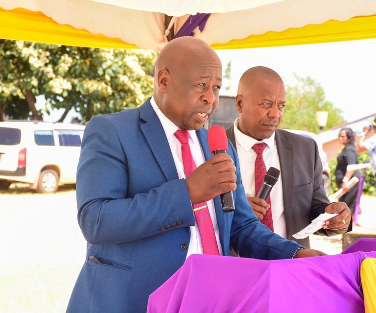 NewFortis Sacco CEO John Mathinji (left) with chairman John Githinji during the AGM at Nyamachaki Comprehensive School grounds in Nyeri town on Saturday.