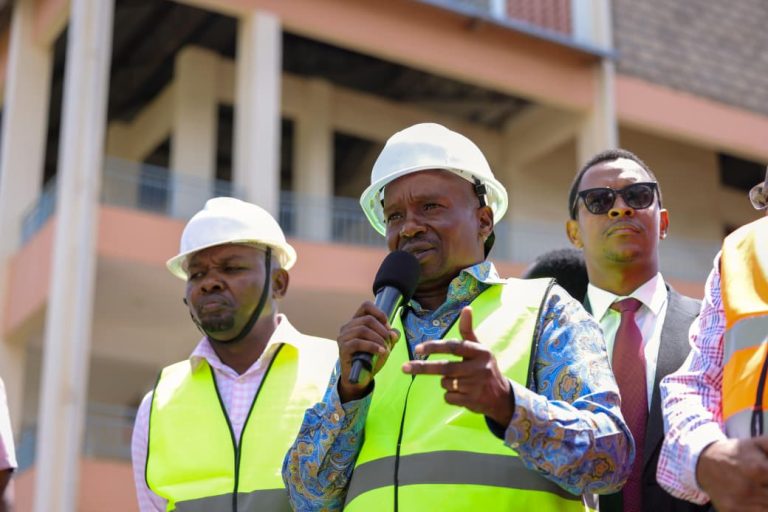 Deputy President Kithure Kindiki addressing Meru residents as local leaders led by Governor Isaac Mutuma (left) looks on.