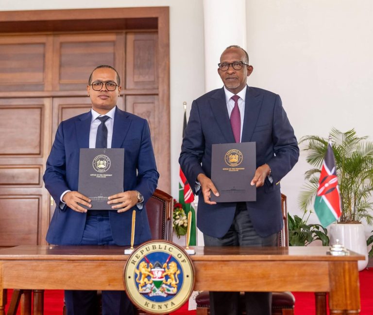 Amsons group CEO Edha Nahdi (left) with CS Health Adan Duale with copies of the signed Letter of Intent.