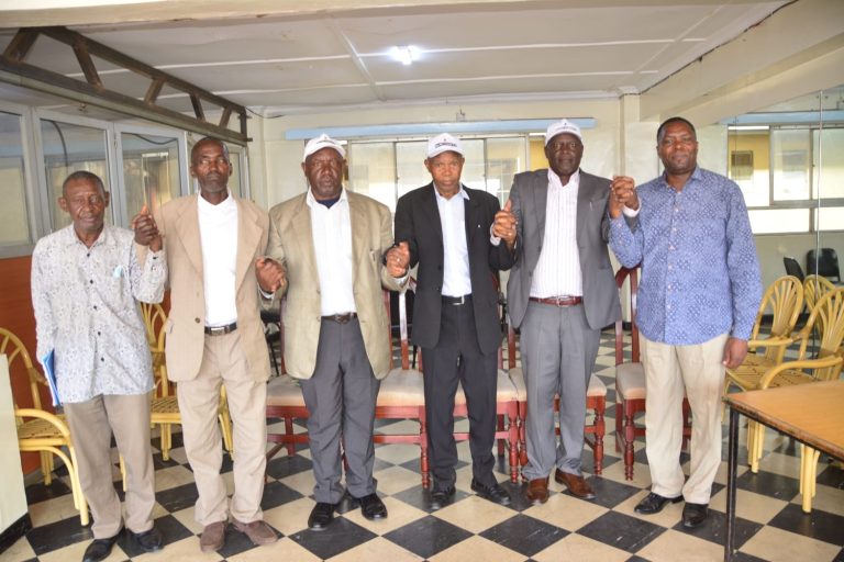 Dr. Field Marshall Ngacha (centre) pictured with members of the Mau Mau Original Trust ahead of their planned national forum at Uhuru Park.