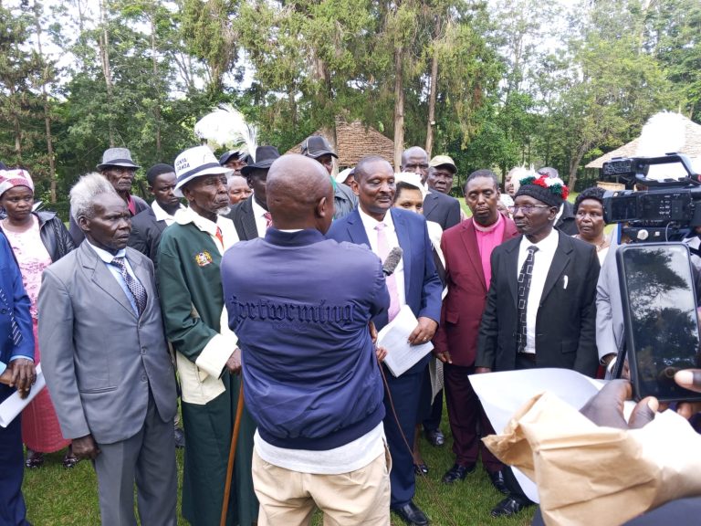 James Njuguna Mahuria receiving documents after the ceremony.