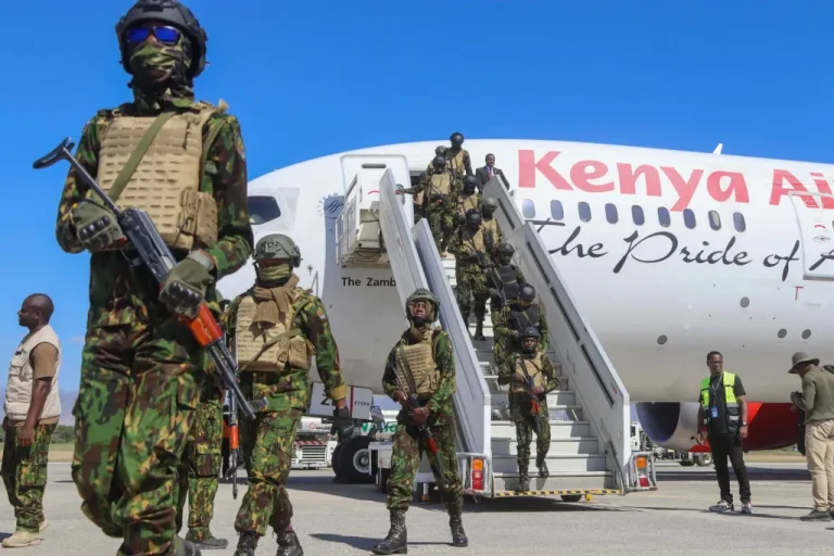 Kenyan police officers leave Kenya Airways, the East African country’s commercial airliner, after landing at Toussaint Louverture International Airport in Port-au-Prince on January 18, 2025.