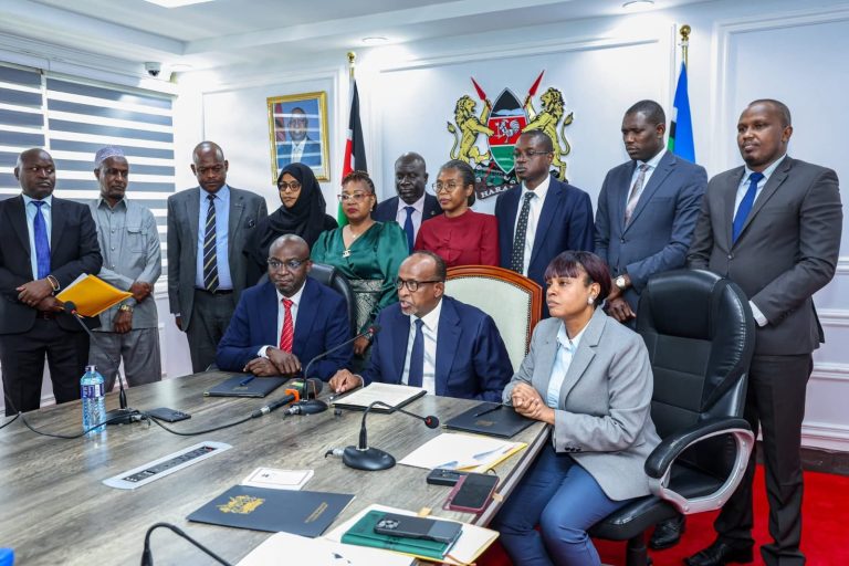 Those who signed are; sitted from left, Lawrence Nyaguti Ochieng, Adan Duale and Mercy Mwangangi.