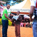 Antony Gitonga gifting a pupil in the past.