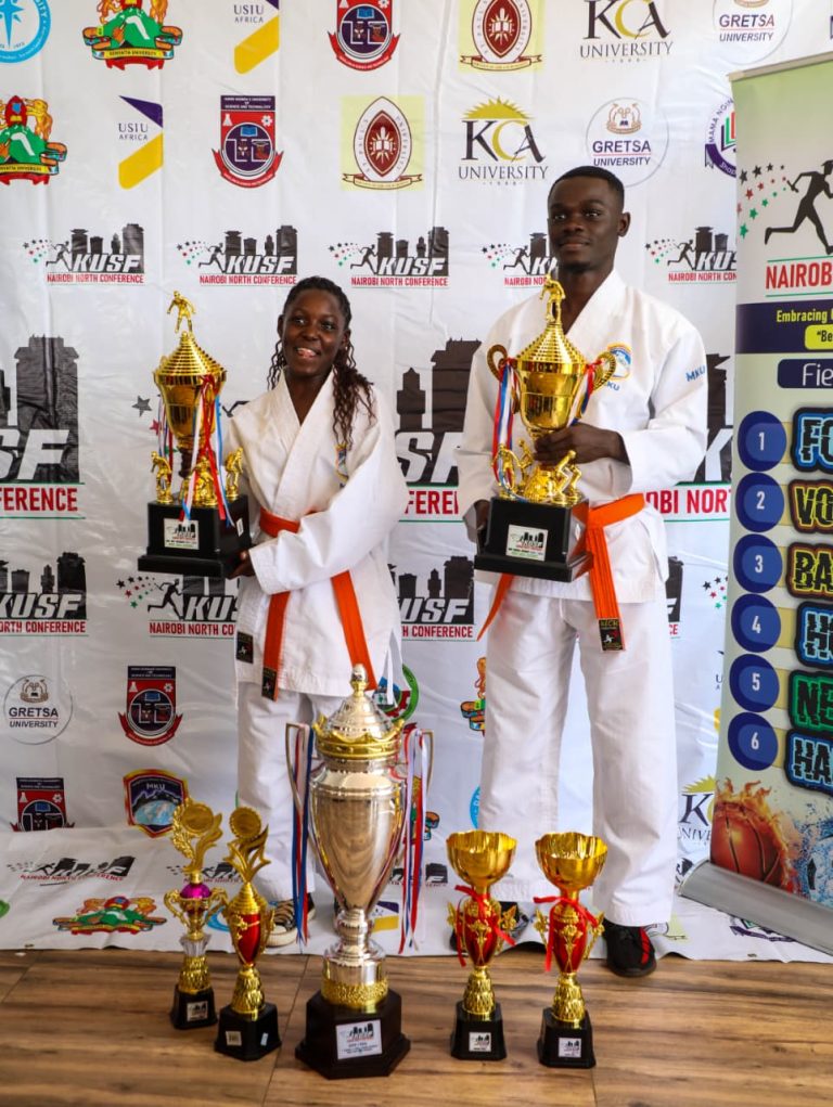 Grace Matanu and Mark Junior, MKU captains pose with trophies won at the Kenya University sports federation Nairobi North conference awards ceremony.