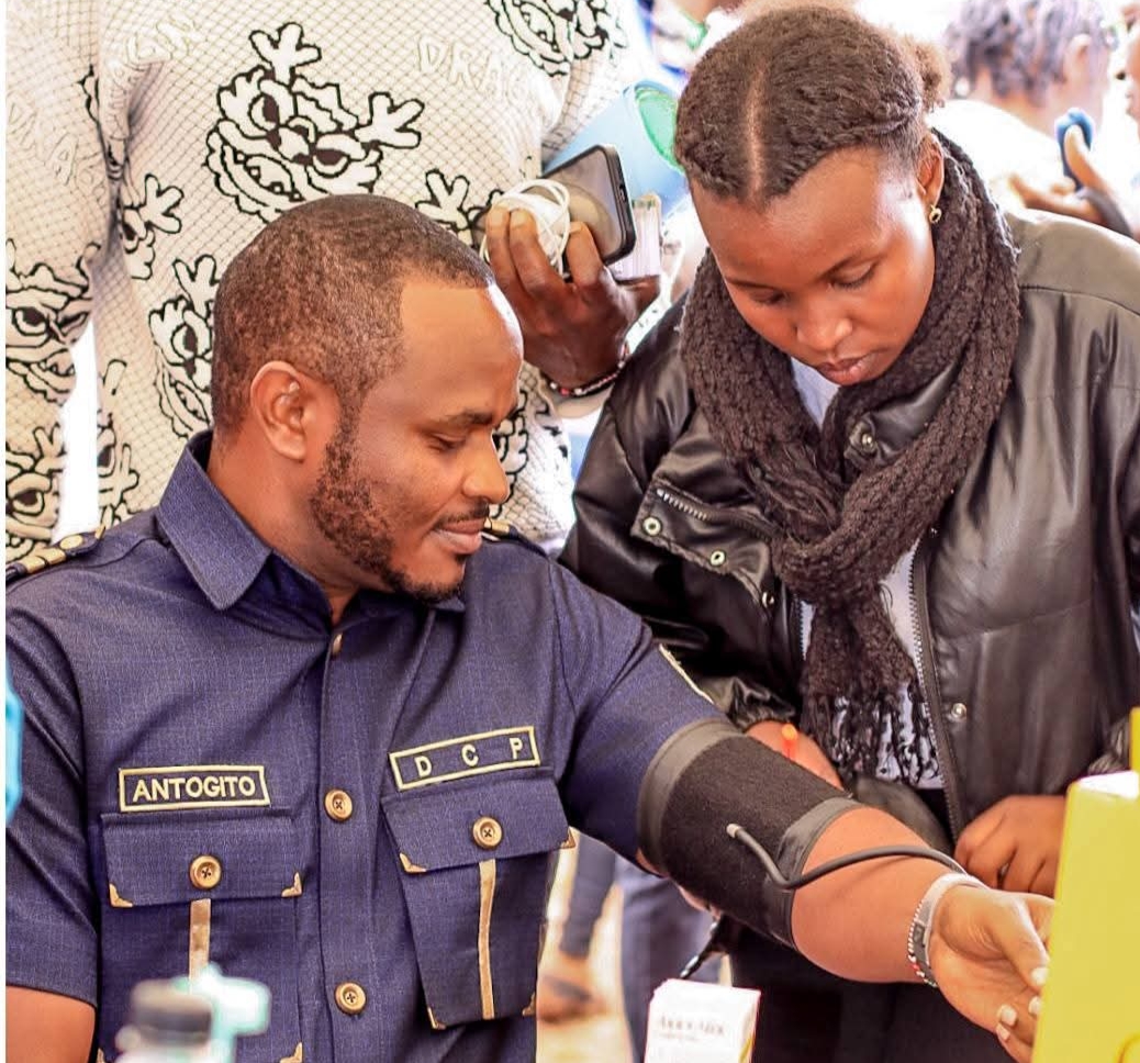 Antony Gitonga Antogito being checked for BP during the free medical camp he sponsored in Othaya.