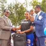 CS Education Julius Ogamba Migos, Gianchere Senior Secondary School Principal Dr Philip Ochoi during the award ceremony