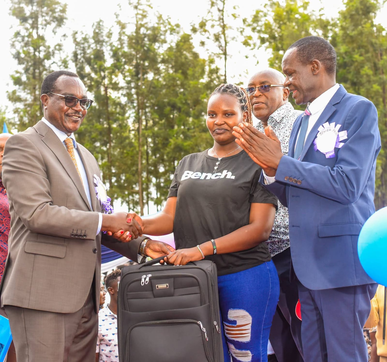 CS Education Julius Ogamba Migos, Gianchere Senior Secondary School Principal Dr Philip Ochoi during the award ceremony