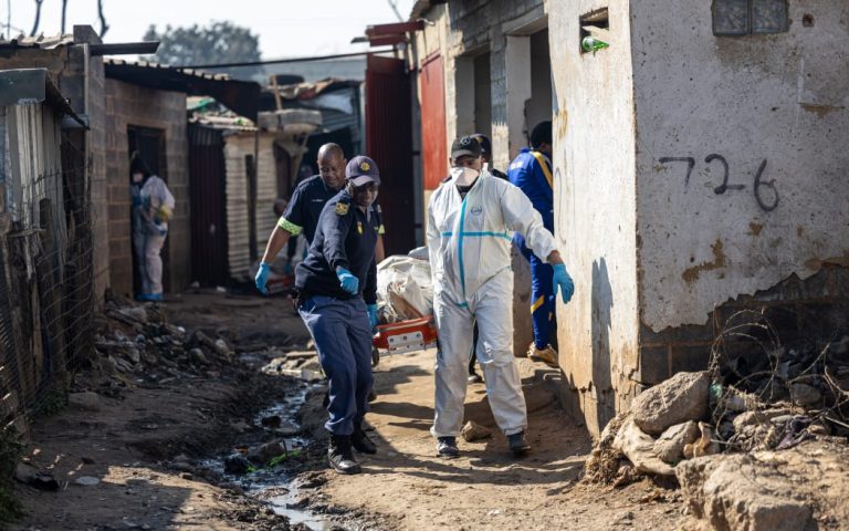 South African Police Service (SAPS) officers along with forensic technicians carry a victim’s body at Jumpers informal settlement in Cleveland, east of Johannesburg, on June 10, 2026. Photo: Courtesy