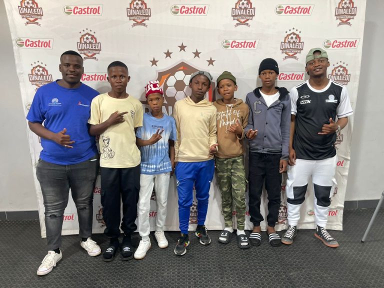 In the picture is Thembelani Majingo with the boys international ( Dinaledi Football Academy) Botswana