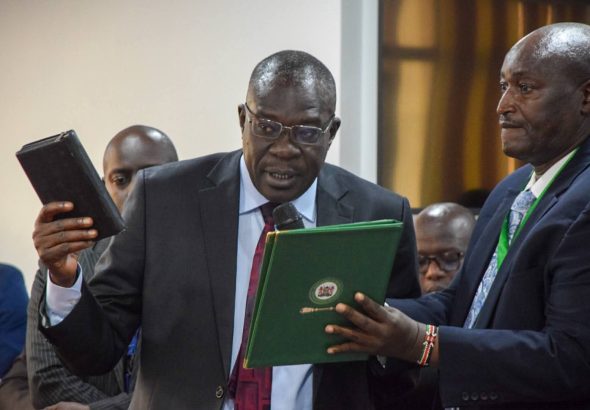 Principal Administrative Secretary in the Executive Office of the President, Mr. Arthur Osiya taking oath before the parliamentary committee yesterday.