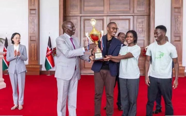 President Dr William Ruto awards Tharaka University lecturer Mr Kevin Tuei for mentoring Kenya's Grand Prize-winning team at the Huawei ICT Competition Global Finals in China.