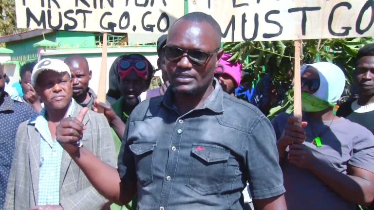 A resident addresses the press during the demonstrations at Nkabune