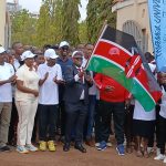 Tenri Group of Hospitals CEO Dr. Jim Njamiu, PhD, HSC, flags off Tharaka University's 530-kilometre charity walk.
