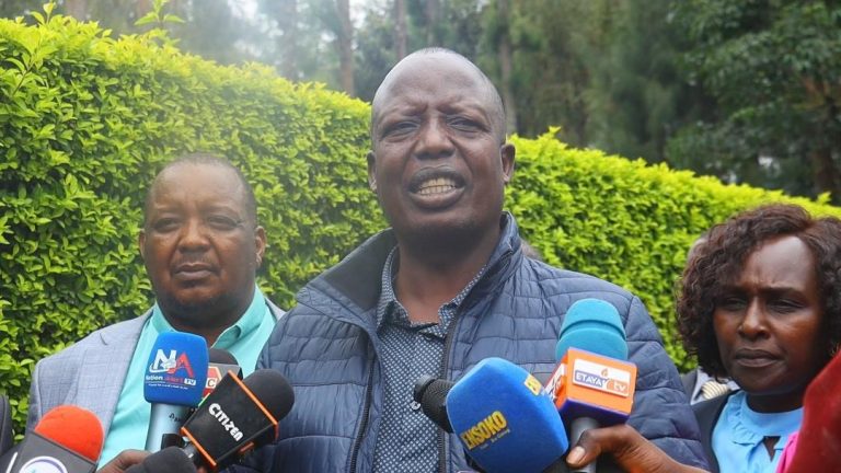 Committee chairman Julius Melly addressing press at Kisi National Polytechnic during the public participation process