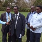 New chairman Dr Paul Mwangi Gatundu addressing the media as Bishop Johnson Mwai (left)