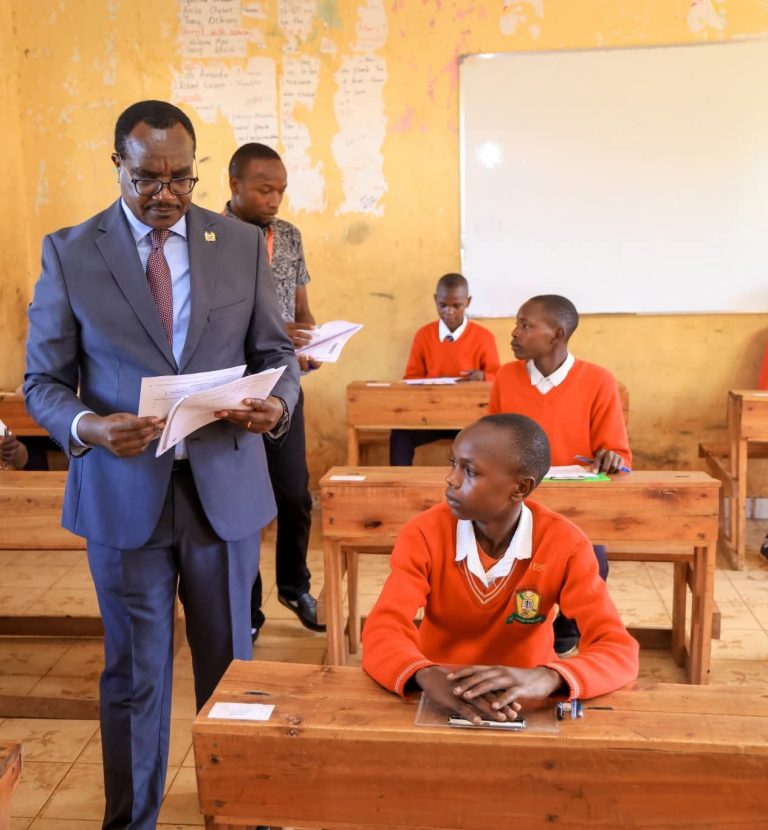 CS Education Julius Ogamba Migos at Sotik Comprehensive School monitoring the administration of the assessments