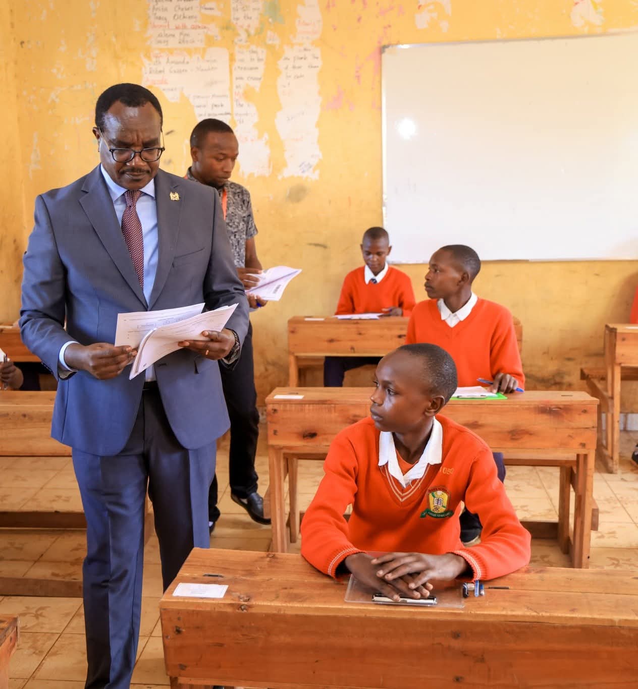 CS Education Julius Ogamba Migos at Sotik Comprehensive School monitoring the administration of the assessments