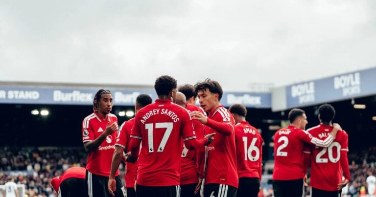 Manchester United players celebrate after scoring against Leeds.