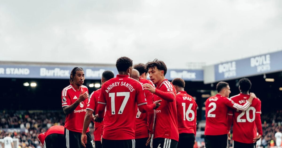 Manchester United players celebrate after scoring against Leeds.