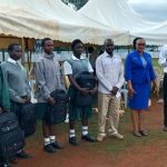 Students receiving bags from well wishers