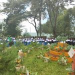 Students receiving their certificates after agricultural workshop