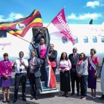 The Permanent Secretary, State Department for Aviation and Aerospace Development, Ms. Teresiah Mbaika (centre) leads Jambojet management and guests in celebrating the inaugural flight to Uganda.