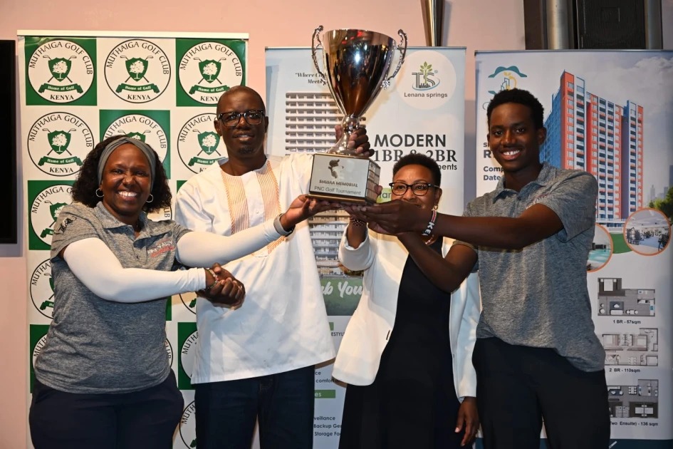 The winning pair of mother & son, receiving the Shujaa Memorial Trophy from Mr & Mrs Kavore Kariuki (L-R)